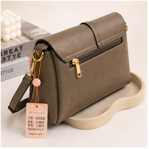 Elegant textured crossbody shoulder bag in Elephant Grey - angled view